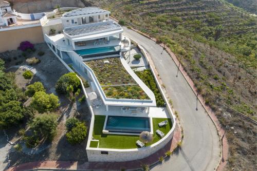 an overhead view of a white house with a pool at Exclusiv Too in Torrox