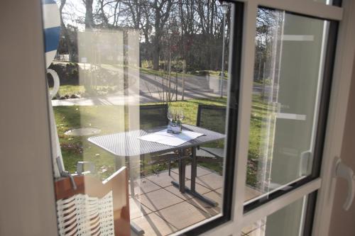 a view of a table from a window at Haus Meeresblick Ferienwohnung Kra in Baabe