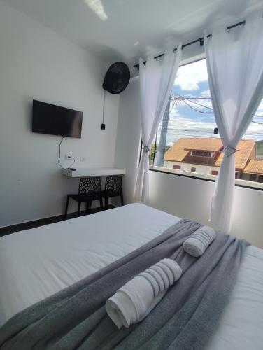 Postel nebo postele na pokoji v ubytování suíte 17 dupla praia de leste