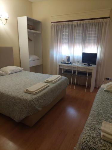 Katil atau katil-katil dalam bilik di Metro Vilar Suites & Villas