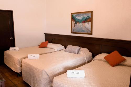 Ένα ή περισσότερα κρεβάτια σε δωμάτιο στο Hotel Villa Española