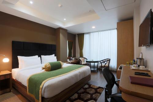 Postel nebo postele na pokoji v ubytování Hotel West Residency Delhi International Airport