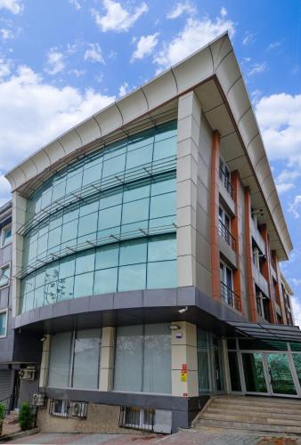 a building with glass windows on the side of it at Private Apartment at Beylikdüzü nearly to E5 2 in Beylikduzu