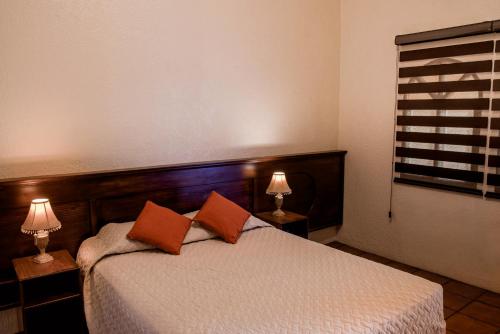 Ένα ή περισσότερα κρεβάτια σε δωμάτιο στο Hotel Villa Española