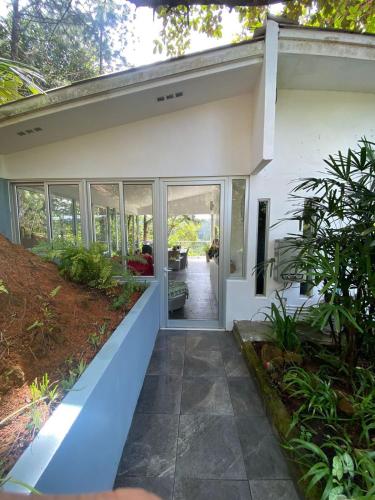 an open door of a house with a porch at Naturaleza, Flora y Fauna in Los Altos de Cerro Azul