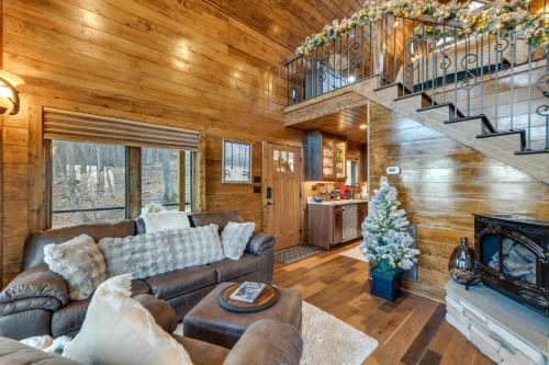 a living room with a couch and a fireplace at Couples Getaway in Stoney Creek at Wintergreen! in Nellysford