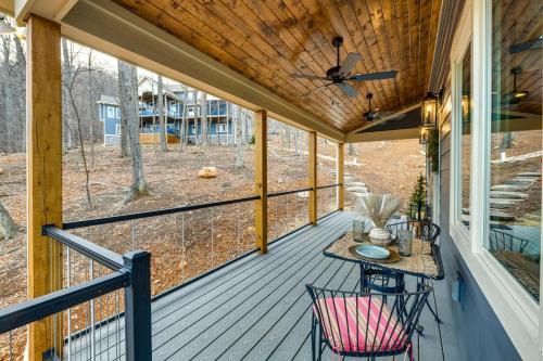 a screened porch with a table and chairs on it at Couples Getaway in Stoney Creek at Wintergreen! in Nellysford