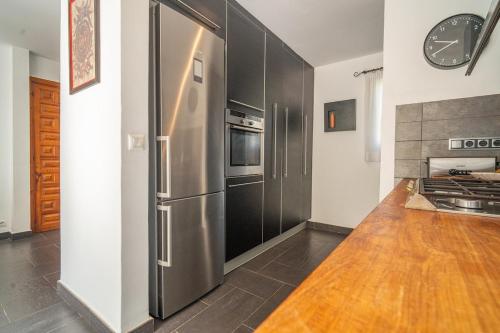 a kitchen with a large stainless steel refrigerator at Villa DEA - Home away from home - Families Only in Salou