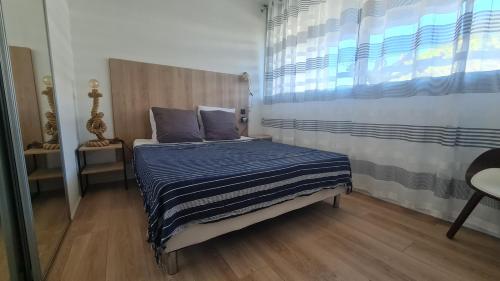 Appartement en RDC climatisé avec terrasse ombragée et privative
