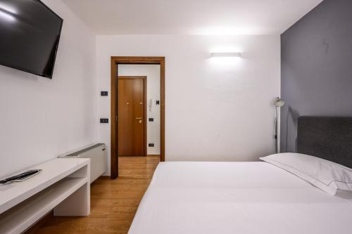 Ένα ή περισσότερα κρεβάτια σε δωμάτιο στο Emilia Studios 4