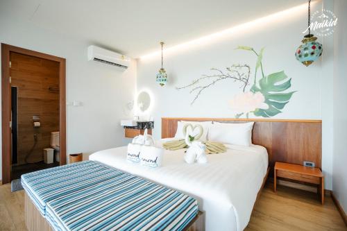 Postel nebo postele na pokoji v ubytování Diamond Beach Resort