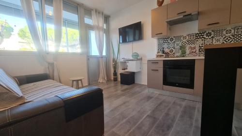 Appartement en RDC climatisé avec terrasse ombragée et privative