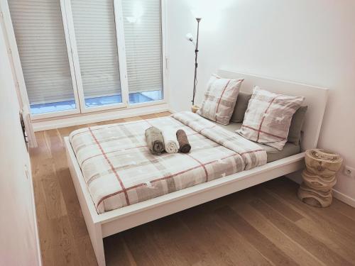 Ένα ή περισσότερα κρεβάτια σε δωμάτιο στο Comme Chez Vous Appartement 2 Chambres