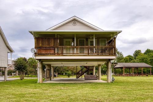a house with a wrap around porch with a deck at River Escape in Pigeon Forge