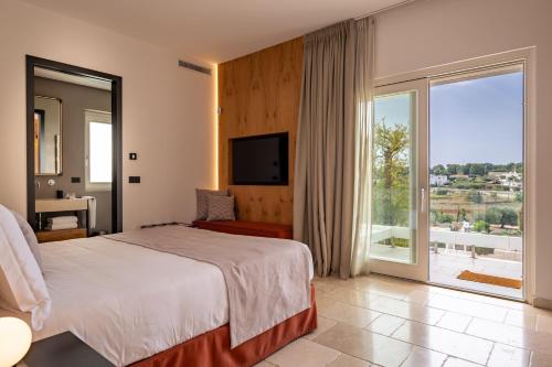 Postel nebo postele na pokoji v ubytování Essenza Relais Contemporaneo