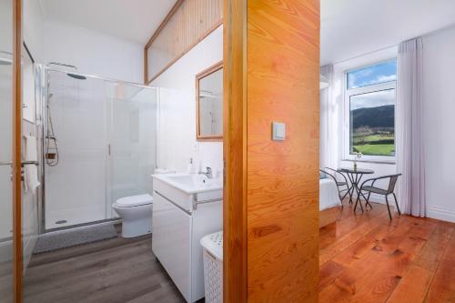 a bathroom with a toilet sink and a shower at Casa Formosa - HOST & CHILL in Porto Formoso
