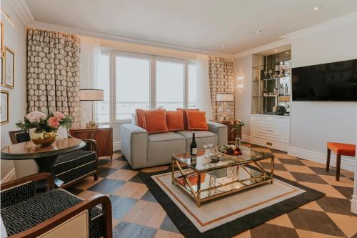 a living room with a couch and a table at Wellington Hotel & Spa Madrid in Madrid