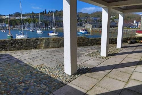 a view of a marina with boats in the water at Glaslyn Harbour Views in Porthmadog