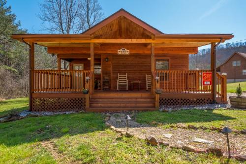 a log cabin with a large deck at Bear Run in Sevierville