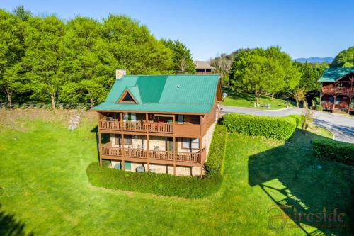 an aerial view of a house with a green roof at Three Bears in Pigeon Forge