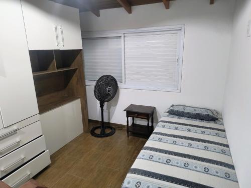 Ένα ή περισσότερα κρεβάτια σε δωμάτιο στο Casa em Boiçucanga - Temporada, finais de semana e feriados