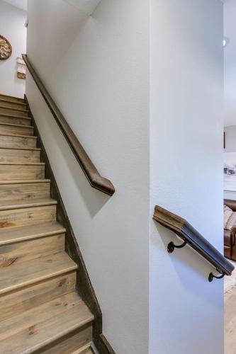 a stairway with a rail and a stair case at Bismarck Farm 2 BR 2 and a half BA New in San Angelo