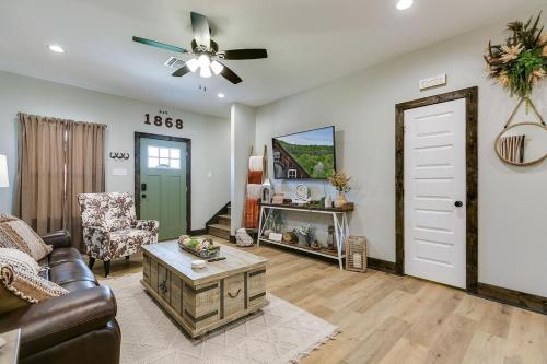 a living room with a couch and a ceiling fan at Bismarck Farm 2 BR 2 and a half BA New in San Angelo
