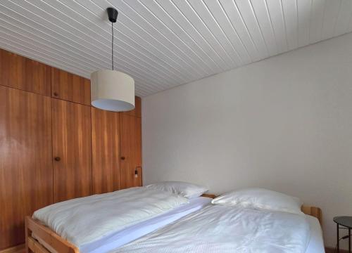 Postel nebo postele na pokoji v ubytování Appartement Tsandelanne avec terrasse panoramique, Val d'Hérens