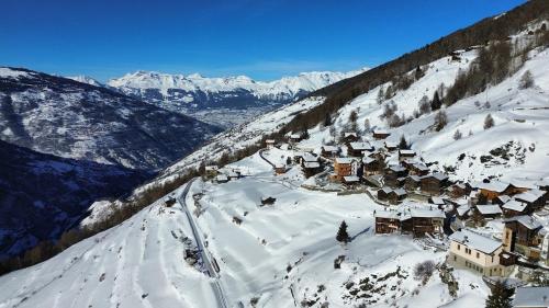Appartement Tsandelanne avec terrasse panoramique, Val d'Hérens v zimě