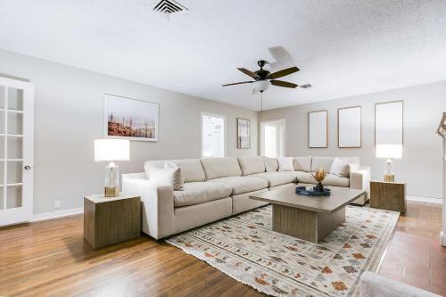 a living room with a couch and a table at 4 BR with 3 BA Turf Backyard New in San Angelo