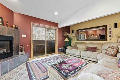 a living room with a couch and a fireplace at Perfectly Located Beaver Creek Vacation Home in Avon