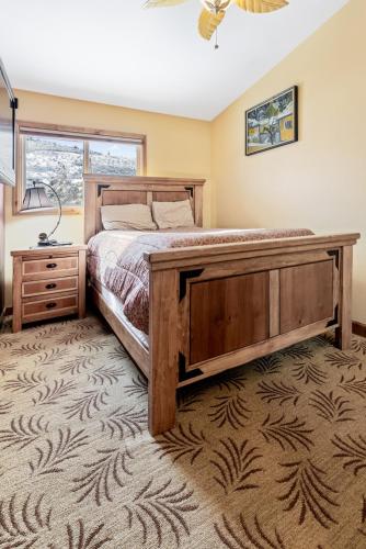 a bedroom with a large bed and a window at Perfectly Located Beaver Creek Vacation Home in Avon