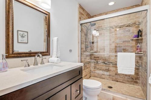 a bathroom with a sink and a toilet and a shower at Spacious Secluded 2 Acres Remodeled Walk To Willit in Basalt