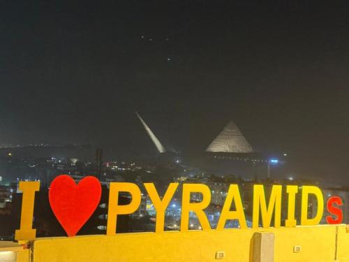 a sign that says i love pyramids and a heart at Pyramids Rafif Hotel in Cairo