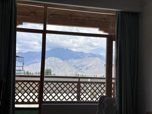 a view of a mountain from a window at The Shava Ladakh in Leh