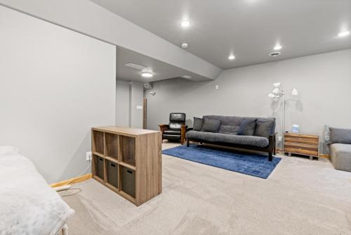 a living room with a bed and a couch at Perfectly Located 3 Bed 3.5 Bath Beautiful Townhome in Edwards