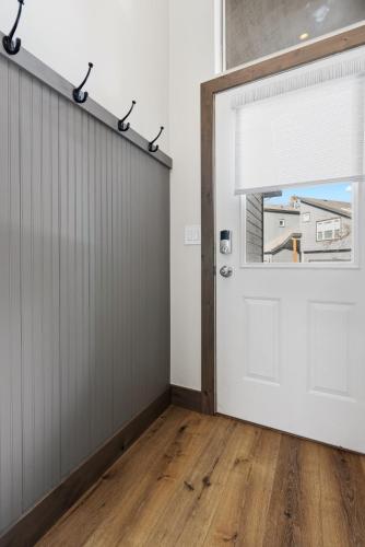 an empty room with a white door and a window at Perfectly Located 3 Bed 3.5 Bath Beautiful Townhome in Edwards