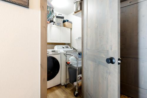 a small kitchen with a washer and dryer at Perfectly Located 3 Bed 3.5 Bath Beautiful Townhome in Edwards