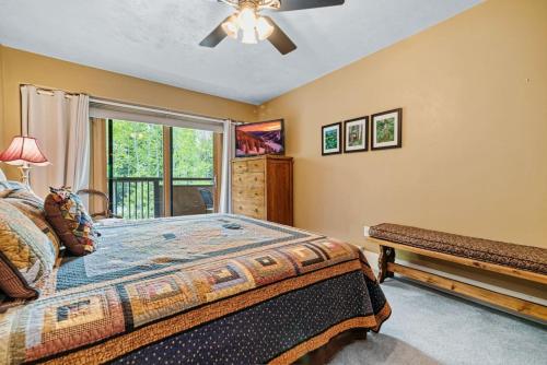a bedroom with a bed and a window at Perfectly Located Vail Home Hot Tub On Bus Lines in Vail