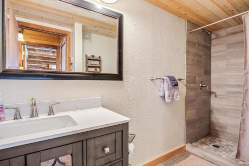 a bathroom with a sink and a shower at Amazing 3200Sq ft Upgrade Log Cbn GameRoom HotTub in Bordenville