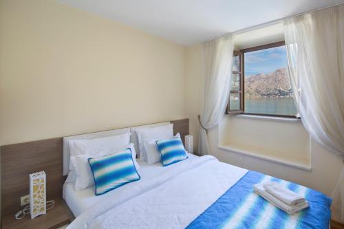 Ένα ή περισσότερα κρεβάτια σε δωμάτιο στο Villa Gina