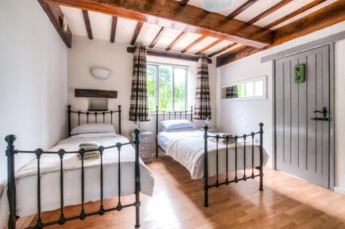 Ένα ή περισσότερα κρεβάτια σε δωμάτιο στο Finest Retreats - Town End Barn