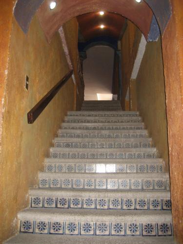 a stairway with stairs leading up to a building at Hotel La Sin Ventura in Antigua Guatemala