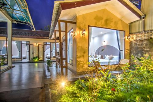a villa with a view of a living room at House of Pi Pleiku in Pleiku
