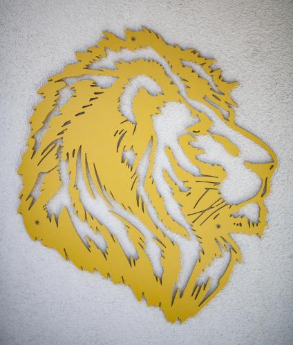 a painting of a tiger on a wall at Logis Hôtel & Restaurant Au Lion d'Or in Burnhaupt-le-Haut