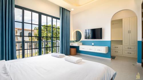 Postel nebo postele na pokoji v ubytování Villa LFP Novaworld Phan Thiết