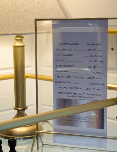 a sign on top of a glass table with a trophy at Ceridwen 6 - Hot Tub-Luxury-Pets-Perthshire-Romantic-Dundee in Perth