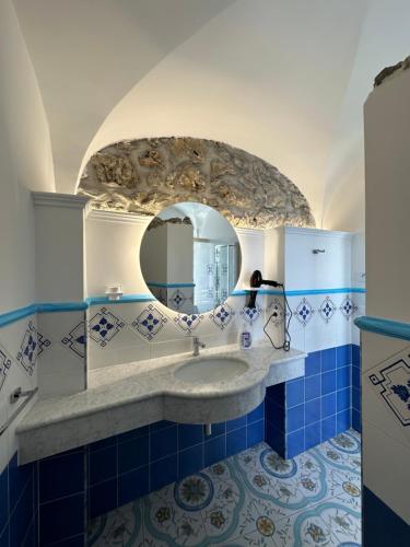 a bathroom with a sink and a mirror at Agriturismo Miramare in Agerola