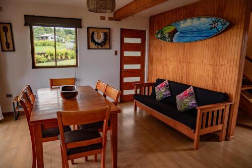 a living room with a table and a couch at Cabañas Anavai Rapa Nui in Hanga Roa