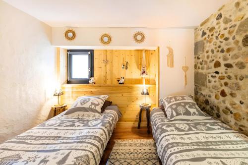 Ένα ή περισσότερα κρεβάτια σε δωμάτιο στο Gîte L'étable